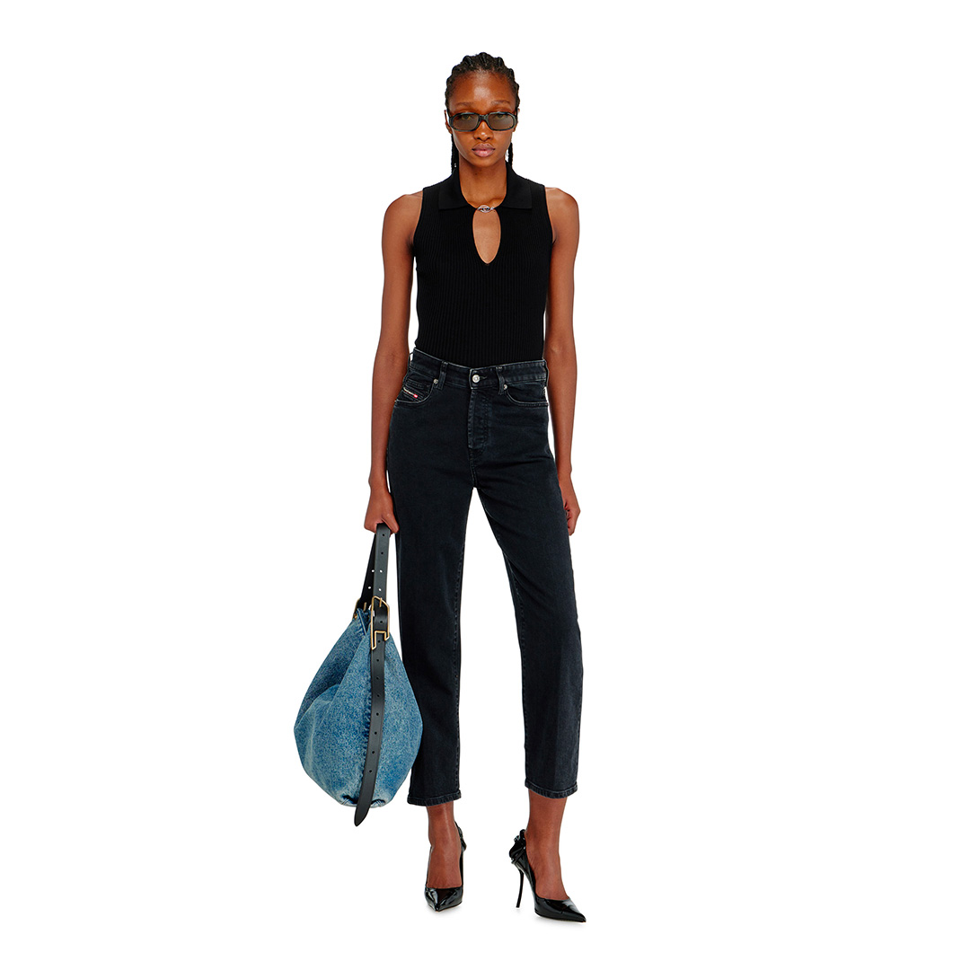 Woman wearing a pair of barrel-leg denim from Diesel